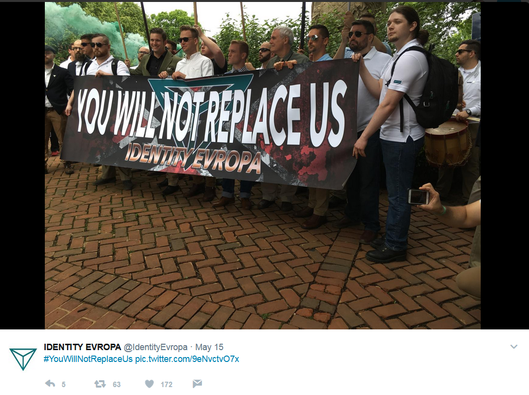 Identity Evropa supporters carry a banner at a march