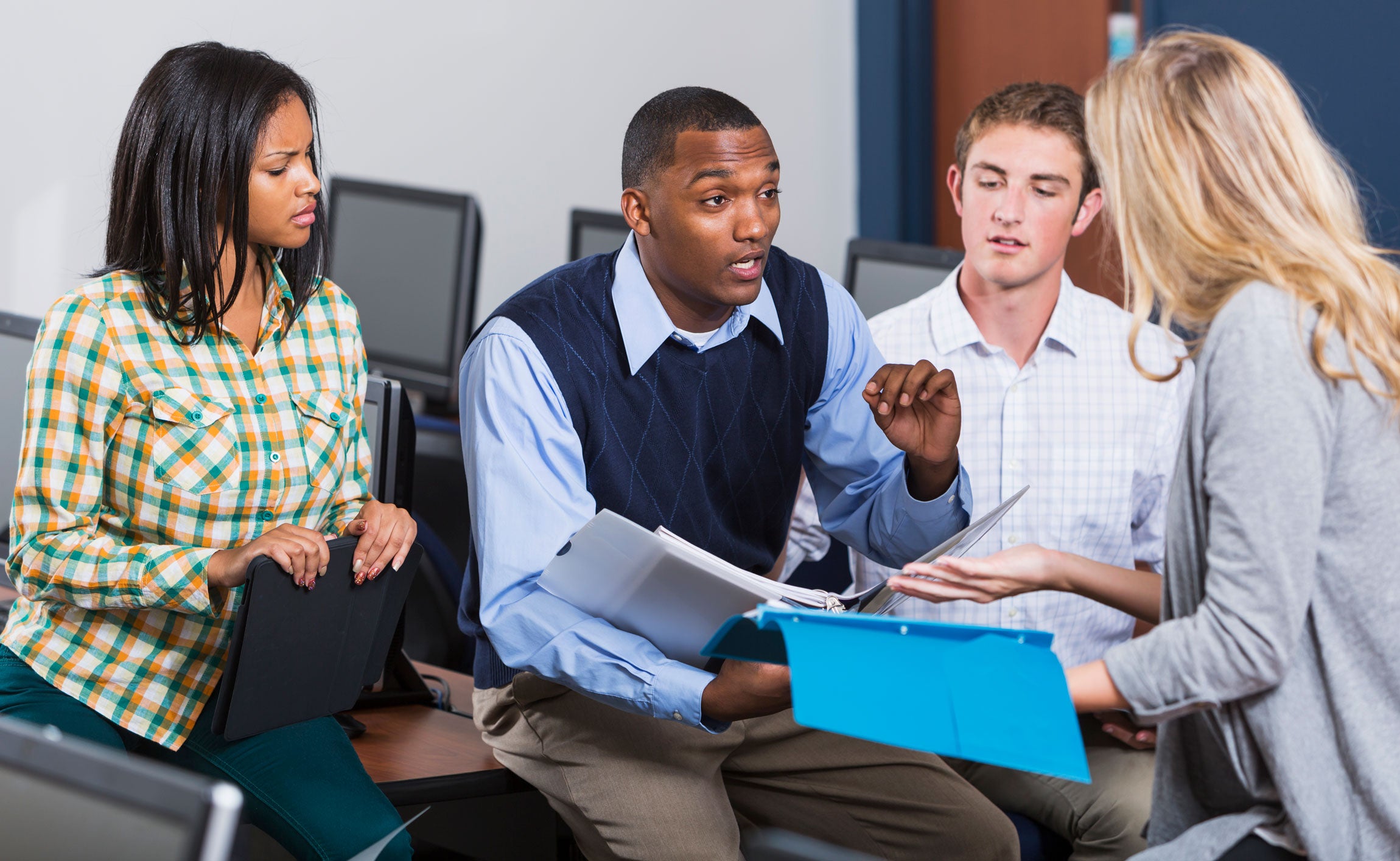 African American Male Teacher with Students in Class