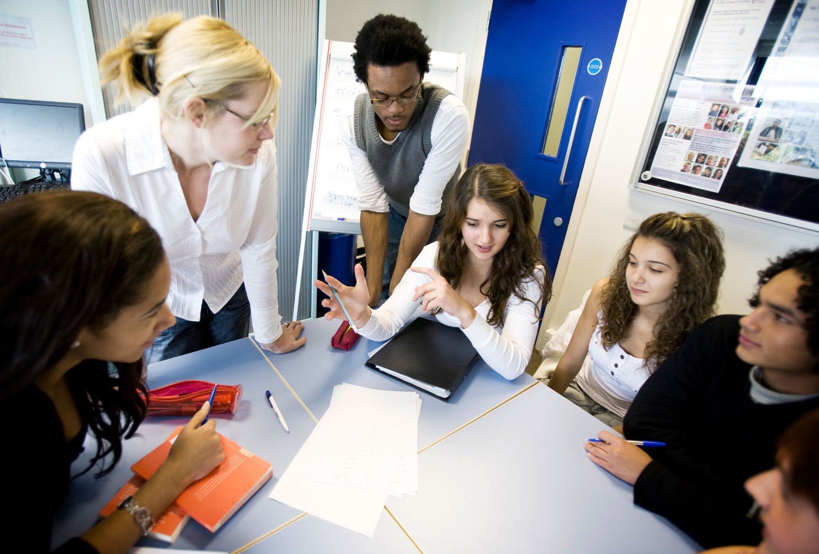 Teenage Students and Teacher in a Class Debate