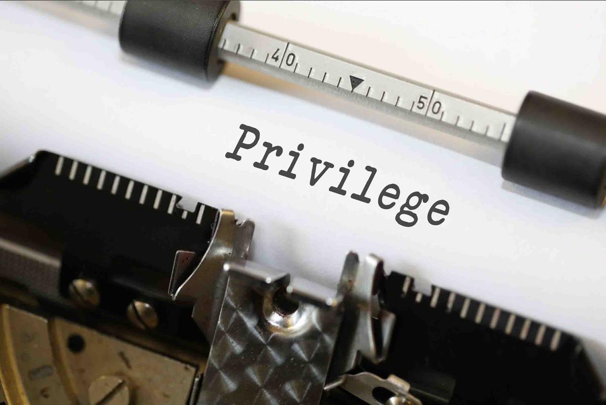 The word privilege typed on paper in a typewriter
