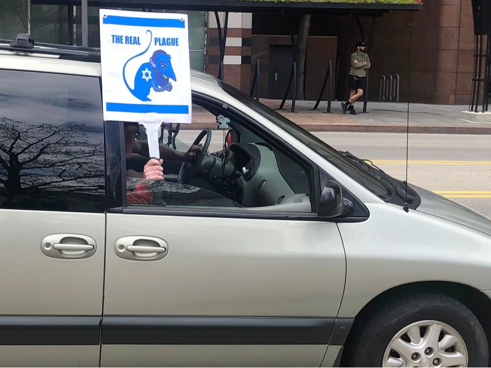 Antisemitic sign at "lockdown" protest