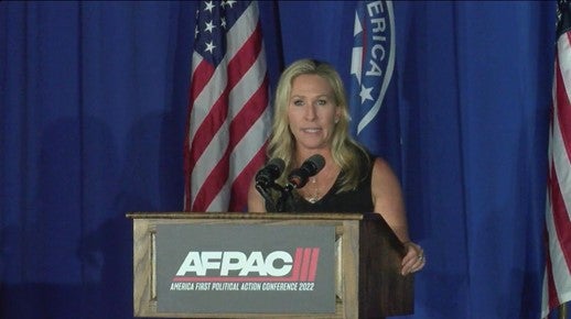 Rep. Marjorie Taylor Greene speaking at AFPAC, an annual white supremacist conference.